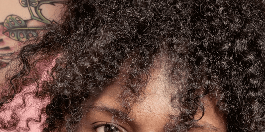 Close-up of curly hair and scalp illustrating dry scalp and dandruff care