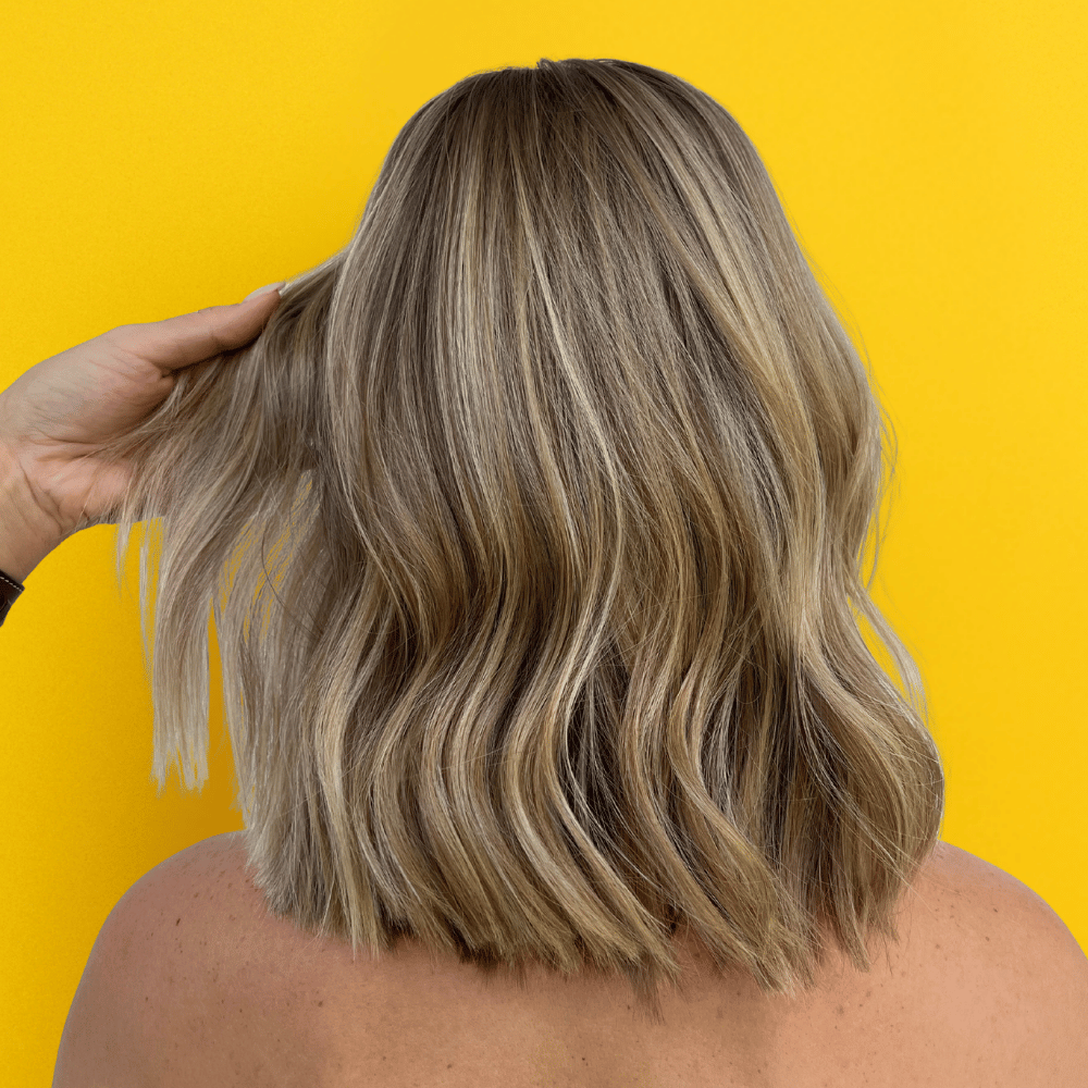 Model with fine hair using Lil J Fine & Fabulous haircare